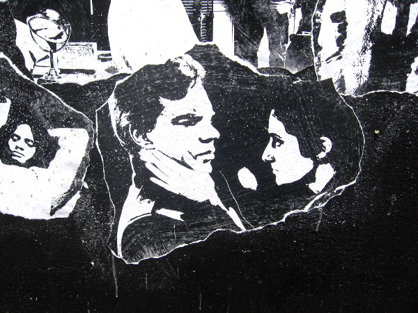 Dramatic faces compose Ion Theatre's complex outdoor mural. The photos are taken from past productions.