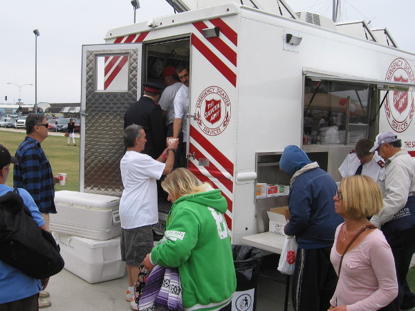 Coffee is served from rear of an emergency disaster services vehicle.
