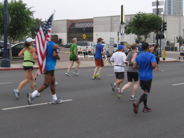 Many flags, signs and costumes were seen all along the race course.