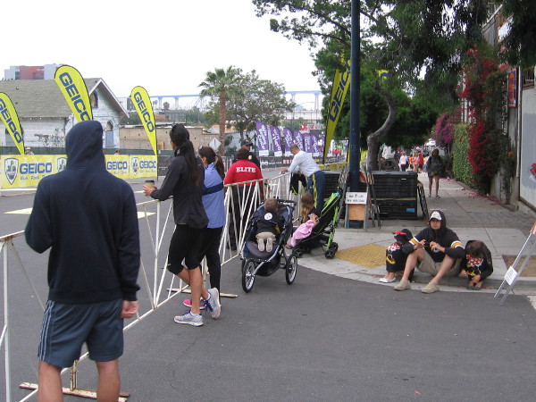 One block from the finish, and the half marathon runners should be here in a couple minutes!