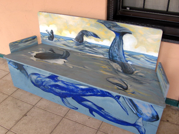 Cool scene of breaching whales decorates this bench found on the North Promenade.