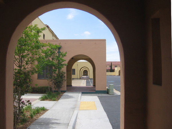 Simple geometry of functional architecture influenced by the Spanish Colonial Revival style.