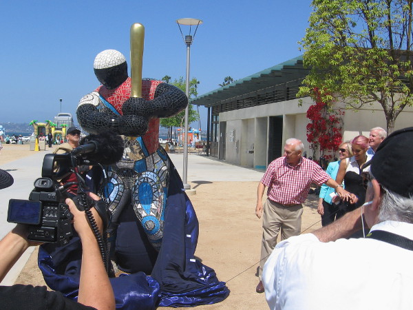 Ron Roberts and the great granddaughter of renowned artist Niki de Saint Phalle reveal a sculpture titled 19 Baseball Player.