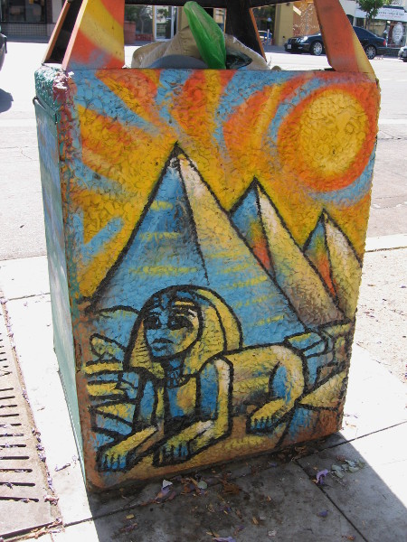 Trashcan with Sphinx and pyramids is appropriate for the Egyptian Quarter, near the intersection of University and Park Boulevard.