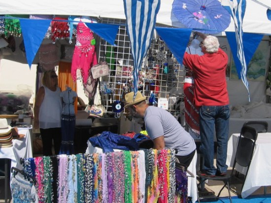 Flags, decorations and colorful wares are a feast for the senses outside St. Spyridon Greek Orthodox Church.