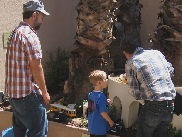 Getting the streetcars ready early one weekend morning before many visitors arrive at the San Diego Model Railroad Museum.