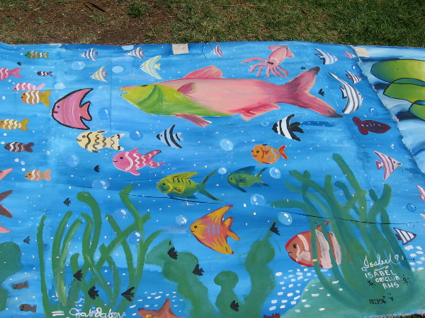 All sorts of exotic tropical fish are swimming at the ocean's bottom.