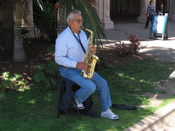 This gent was playing a cool sax in the shade.