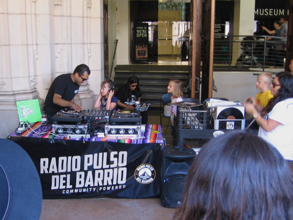 Radio Pulso del Barrio, an internet station out of Barrio Logan, was teaching one and all how to be a DJ for the day!