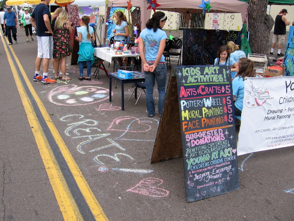 Kids were invited to express themselves with pottery, painting and chalk art.