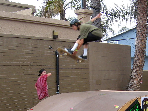 Skater catches huge air as he performs trick from a ramp, wowing everybody watching!