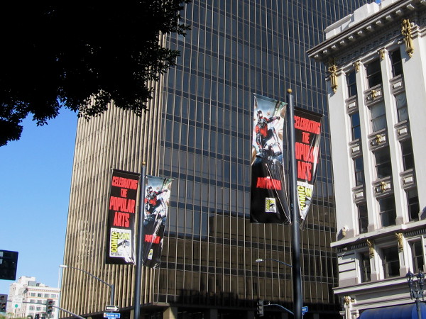 Large Marvel Ant-Man movie banners flutter in the breeze down the center of Broadway.