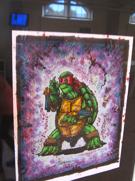 Colorful graphic depicts Raphael, of the Teenage Mutant Ninja Turtles.