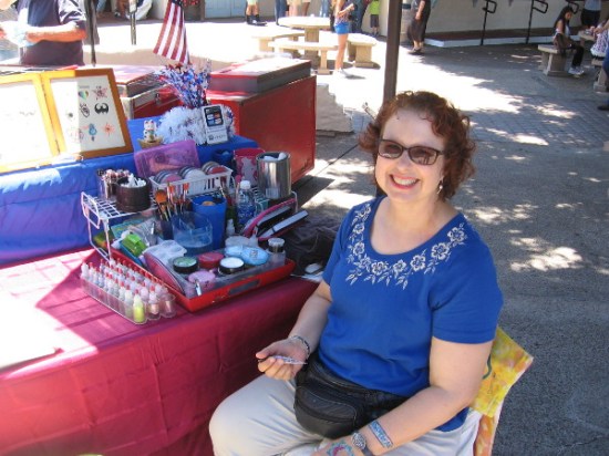 I learned the henna tattoo artist is named Natasha! Great smile!