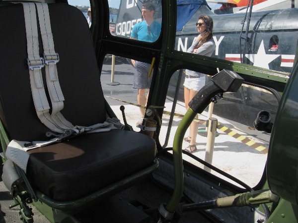 Peering through cockpit of HO3S utility helicopter at the nearby HUP Retriever.