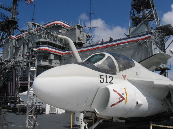 A-6 Intruder bomber on display near USS Midway's superstructure.