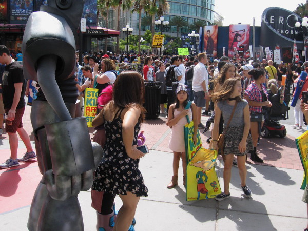 A huge crowd of Comic-Con enthusiasts has assembled at the entrance to San Diego's Gaslamp Quarter.