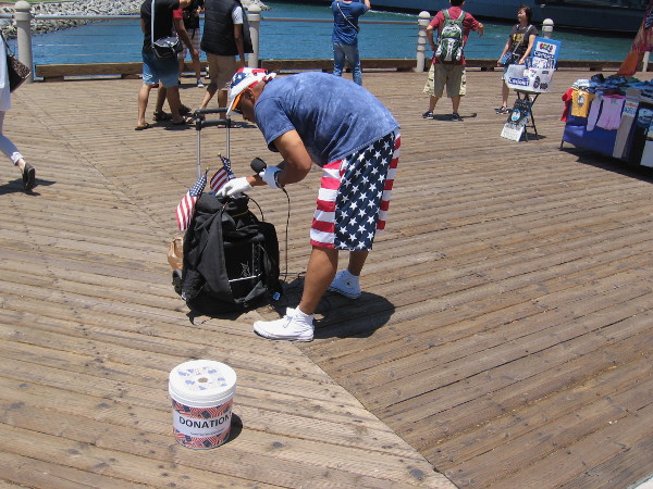 A street performer wears the Stars and Stripes. Looks like he's ready to go this Fourth of July weekend.