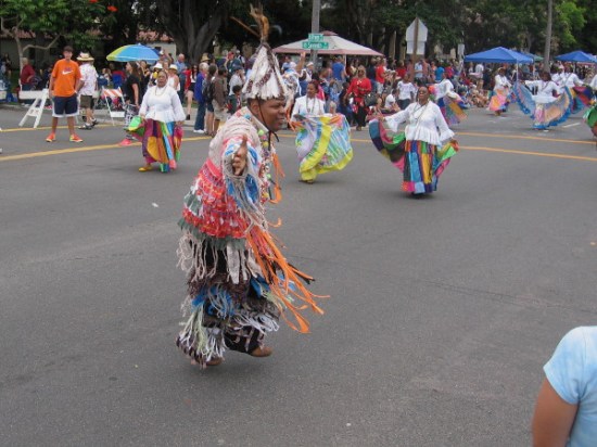 A colorful costume gets onlookers in the mood for a big, fun parade.