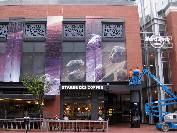 Half of a large wrap applied to Hard Rock Hotel building. Resembles the Ascension graphics from last year.