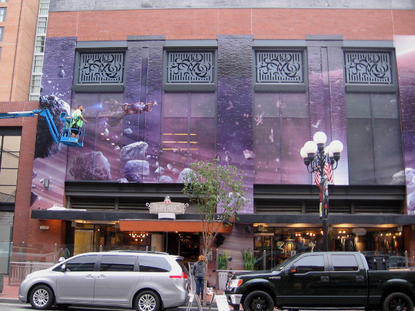 Other half of the cosmic, purple wrap. I see an asteroid field and spaceship.