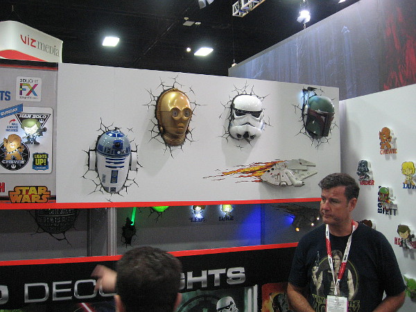 R2-D2, C-3PO, a stormtrooper, Boba Fett and the Millennium Falcon are busting through a wall.