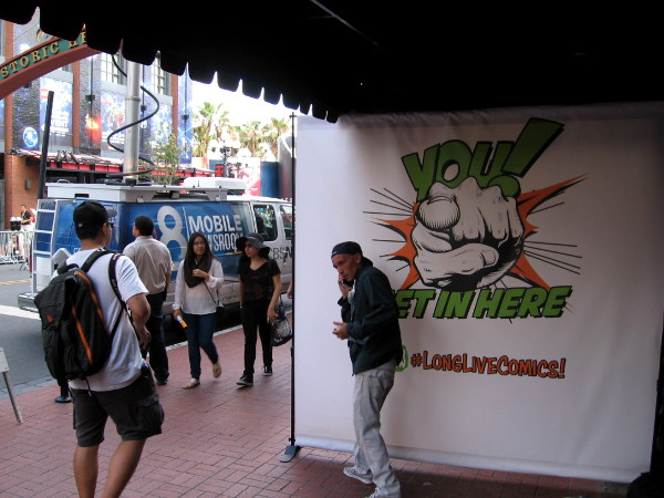 You, get in here! It seems everyone is trying to attract the attention of thousands of Comic-Con attendees.