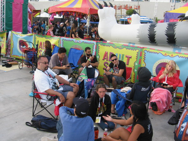 Hunkering down for a long wait behind the San Diego Convention Center. These guys are near the Adult Swim carnival.