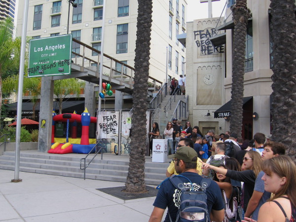 Comic-Con goers lined up to experience rampaging zombies at Walking Dead offsite venue at Hilton Gaslamp.