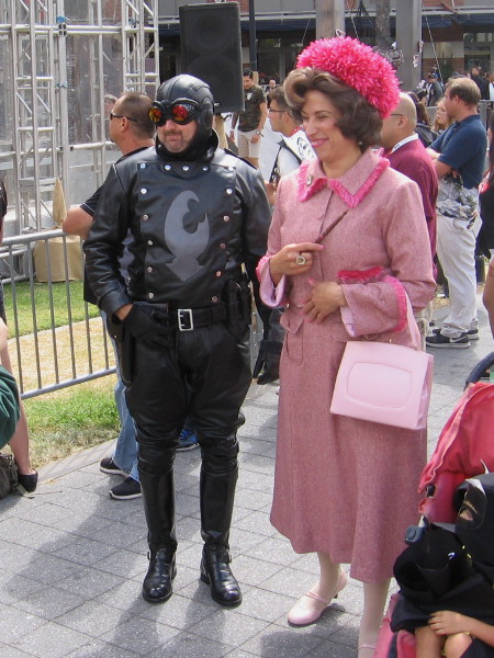 I think that's Dolores Umbridge from Harry Potter. Who's the guy with her? He looks familiar.