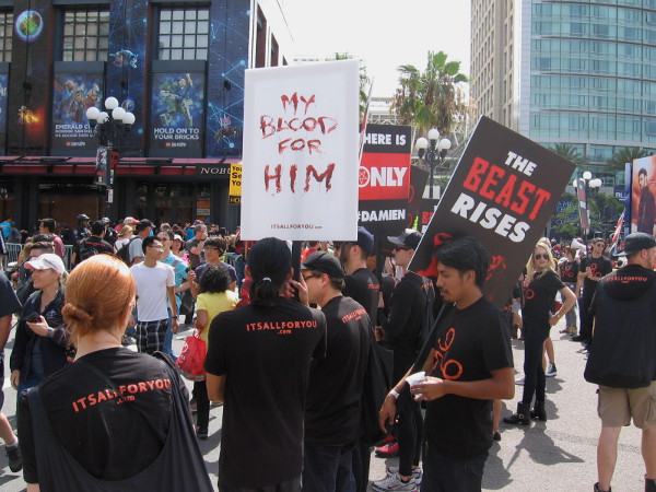 Hired street actors perform creepy chants to promote upcoming television series Damien. The Beast Rises! And so does the hype!