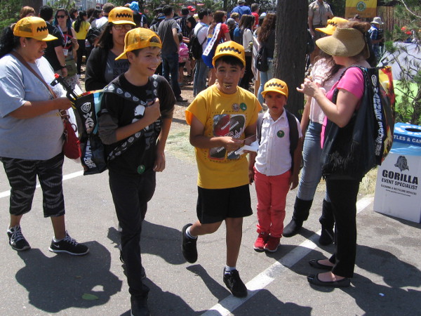Family sports Charlie Brown baseball caps after visiting the nearby Peanuts Movie fun site.