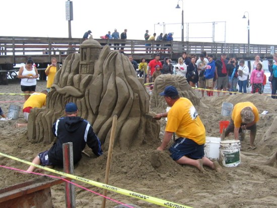 The I.B. Posse team is crafting a complex, exotic scene of Myths and Legends out of sand near the Imperial Beach pier.