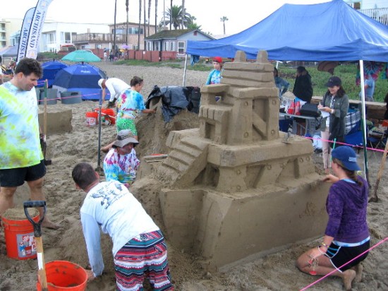 This team wearing tie-dye was creating a hip sand scene with a fun, fanciful 60s flavor.