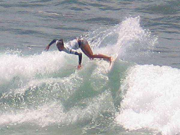 Cool photo of superhuman surfing action at 2015 Supergirl Pro. This year a record 108 contestants entered the huge three day competitive event.