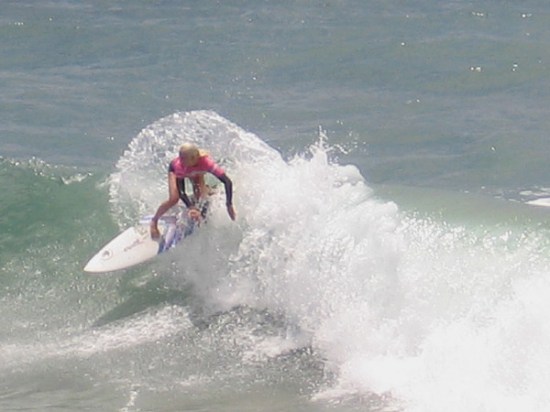 Cool photo of today's surfing champion shredding the crest of a wave.