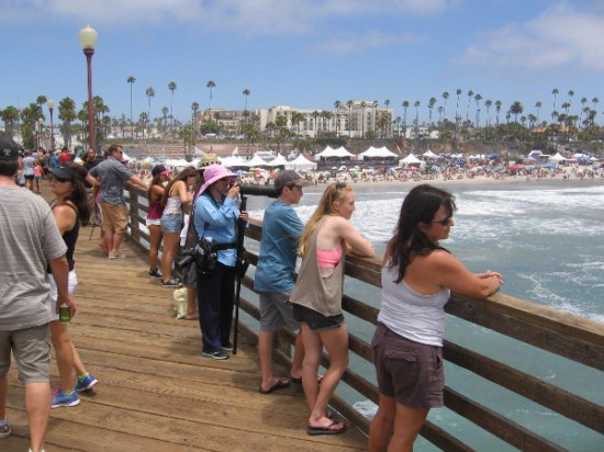 Eyes are fixed on the water below.