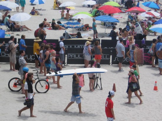 Blogging about an awesome surf event requires a photo of someone walking along with a surfboard on their head!