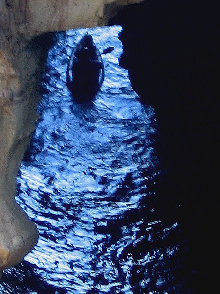 Beyond darkness lies the magical source of shining blue. They soon vanish–passing from one amazing world into another.