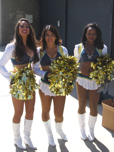 San Diego Charger Girls cheerleaders smile as fans enter Qualcomm Stadium for FanFest.