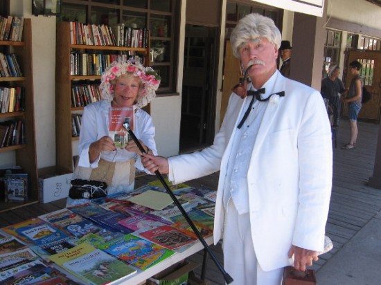 Mark Twain uses his cane to point out his classic novel The Adventures of Tom Sawyer. Many 19th century authors and fictional characters were seen walking about during TwainFest.