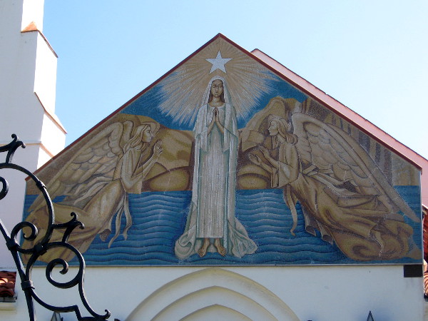 Classic religious imagery floats above entrance to Mary, Star of the Sea Catholic Church in La Jolla.