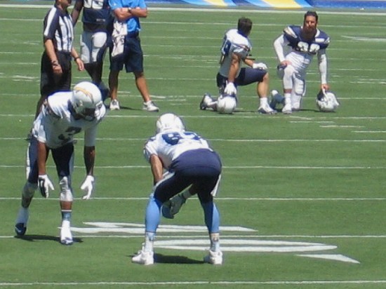 Some scrimmaging begins as players face each other and test their skills on the field.