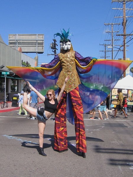 I don't know the name of this tall guy with the rainbow wings and multiple carnival mask faces. Lots of people were posing for photographs.