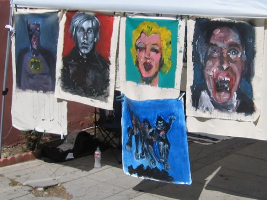 I see Batman and Marilyn Monroe, among other boldly painted faces.