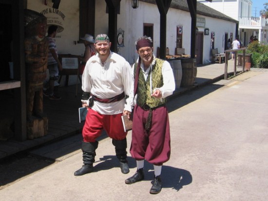 Not to miss this history and literature-inspired event, a couple of fun-loving pirates come shuffling along through Old Town's central plaza.