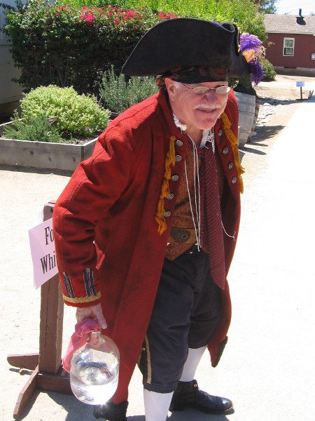 Oh, goodness! It's one of the most famous fictional, rascally pirates of all! Long John Silver! What's that in the bottle