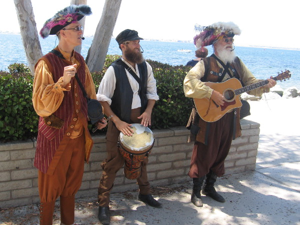 These gents in festive old-fashioned costumes were providing music in one corner of the park by the water.