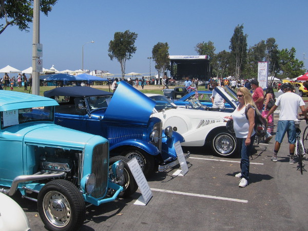 A cool car show had a bunch of hot rods and vintage automobiles out on display.