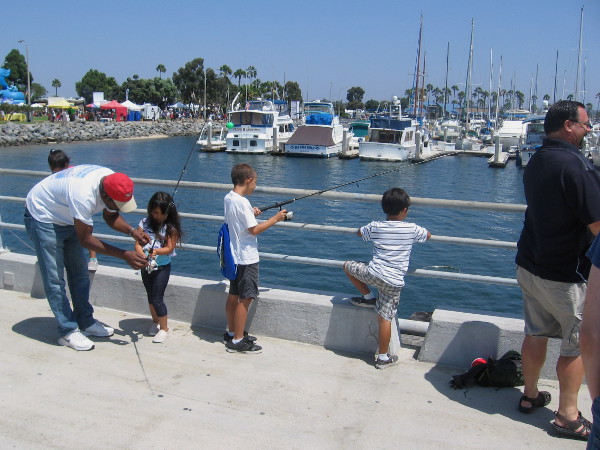 These young fishermen are enjoying the water and a view of the Chula Vista Marina.